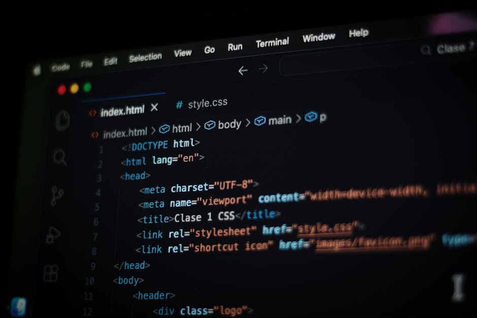 A close-up view of a computer screen displaying HTML code in a code editor. The code includes tags such as <html>, <head>, <title>, and <link>, along with attributes like charset, viewport, and rel. T